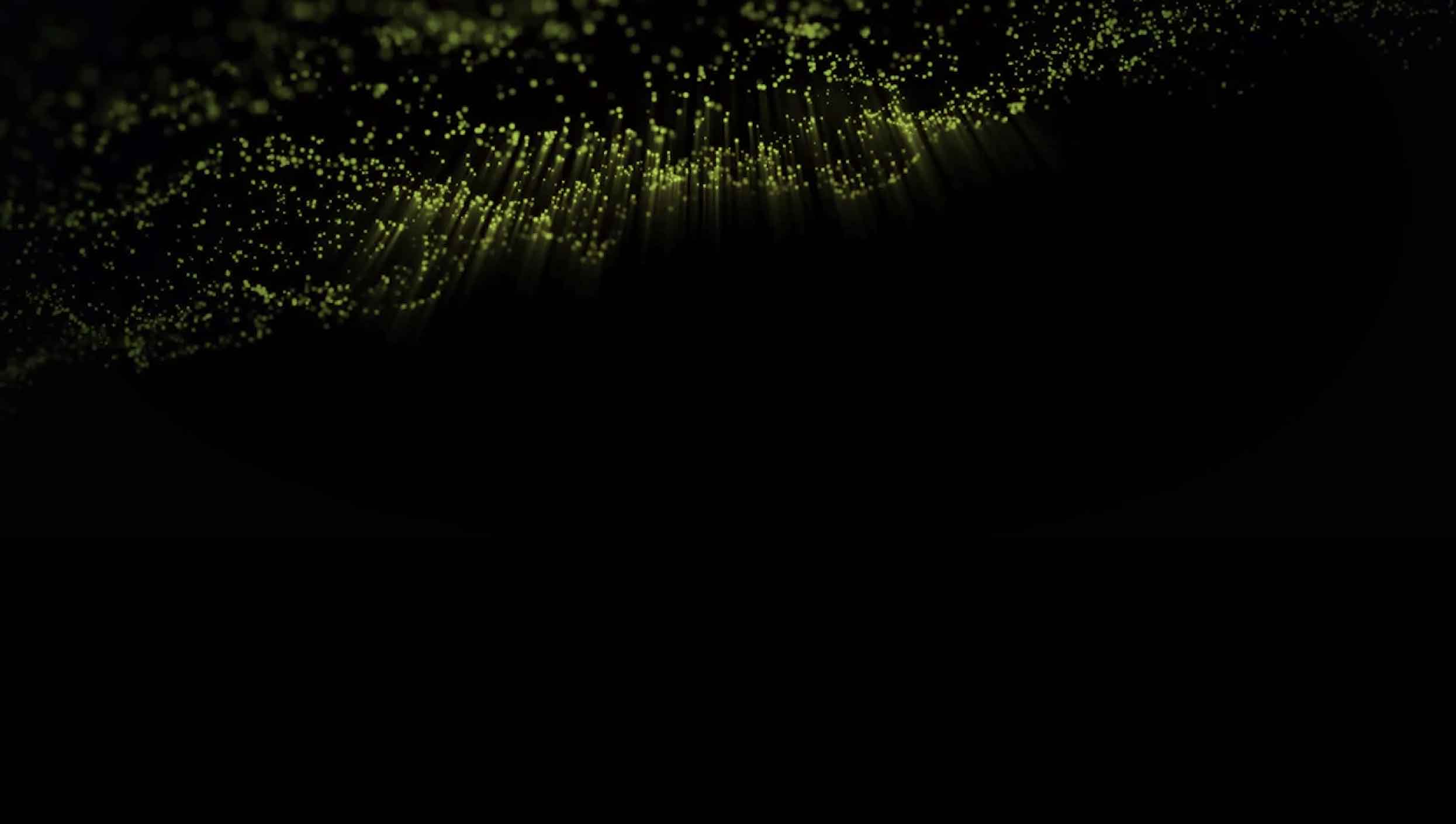 Slide background: Glowing green bubbles floating on the surface of an unlit liquid with light rays projecting downward.