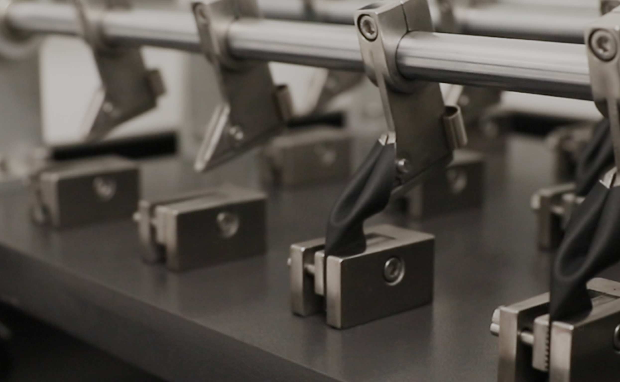 von Holznausen chemist in a lab coat holding a shoe made of Liquidplant in the laboratory
