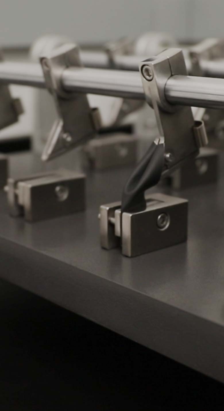 von Holznausen chemist in a lab coat holding a shoe made of Liquidplant in the laboratory